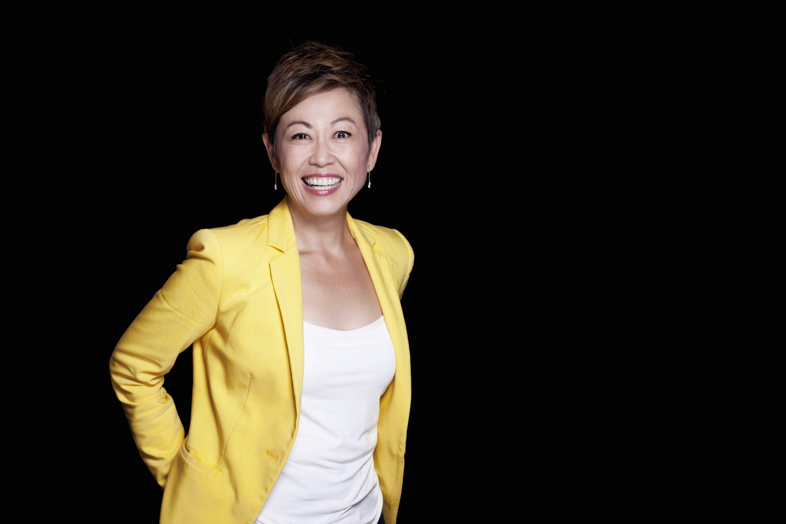 Clinical Radiologist Emmeline Black Background, Yellow Jacket