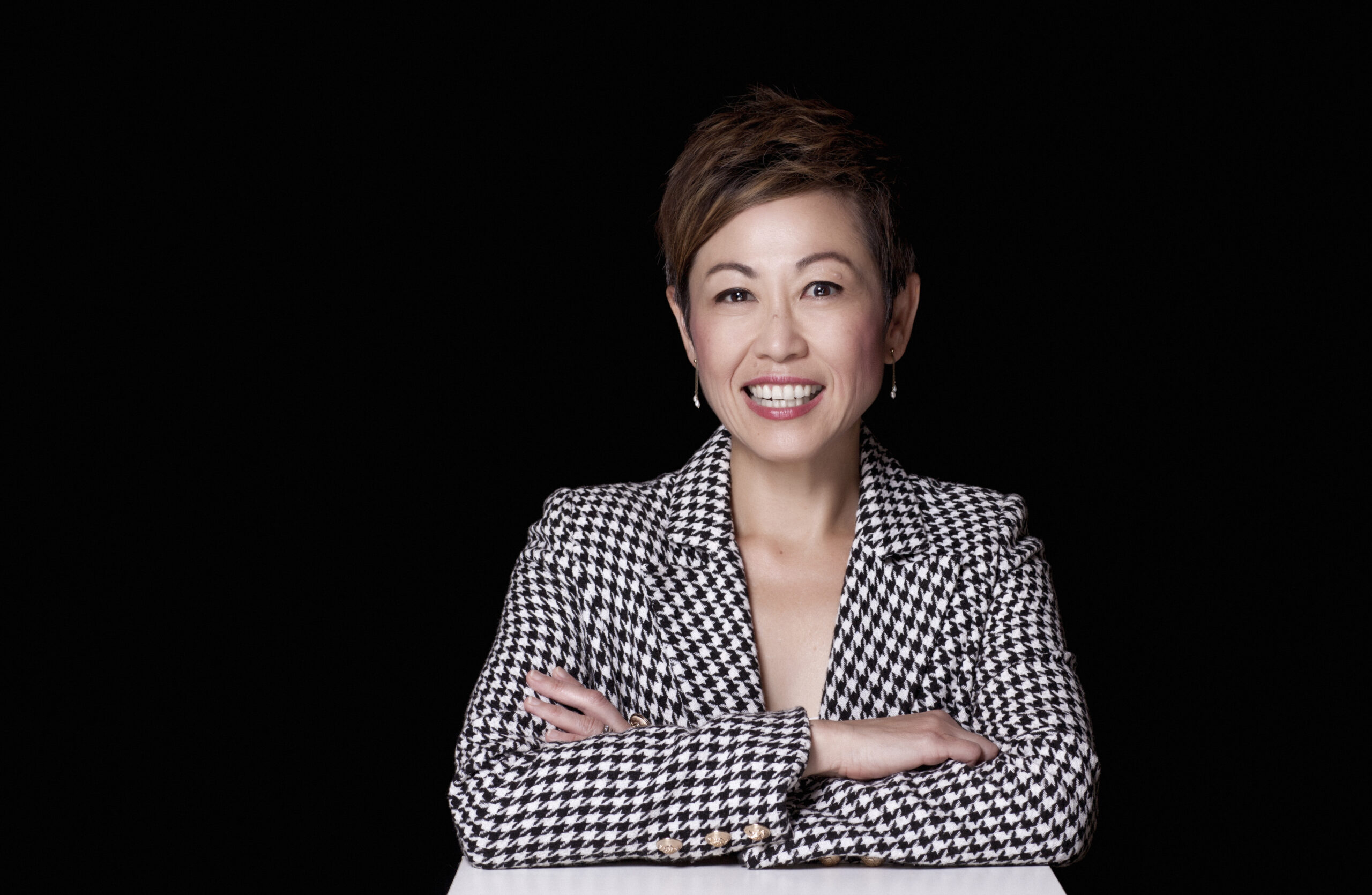 Emmeline Lee Clinical Radiologist Grey Jacket Black Background